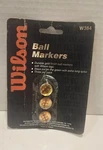 Wilson Embossed Ball Markers W384 Gold Finish Logo (3 Per Pack). Fixed Price $17.00.