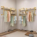 Gold Industrial Pipe Wall-mounted Clothing Rack With Wood Shelves & Dual Rods. Fixed Price $249.99.