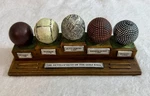 Vtg Development Of The Golf Ball Faux Wood Display Paperweight, 7.75 Long.. Fixed Price $23.99.