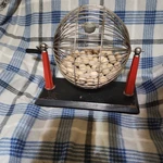 1930-1940S Vintage Bingo Cage Metal Wire Red Bakelite Base Wooden Balls. Fixed Price $100.00.